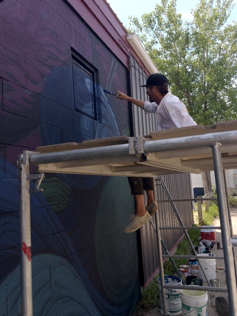 Artist on scaffold